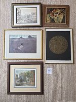 Top view of all five framed prints laid out on carpet, showing various art styles and frame designs including Andrew Wyeth's Christina's World