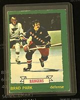 Front of 1973-74 O-Pee-Chee Brad Park New York Rangers hockey card with green border and player action image.