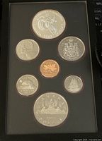 Front side of coin set showing various Canadian coins including silver double dollar coin and smaller denominations in proof condition.