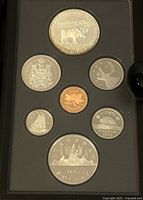 Photo of front face of 1985 Canadian proof coin set featuring various denominations including double dollar coin.