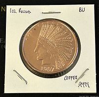 Obverse side of 1 oz copper round showing Indian Head wearing feathered headdress and stars with 1907 date