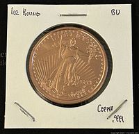 Obverse side of the 1oz Liberty copper round showing Lady Liberty with torch and olive branch, 1983 date visible, in protective holder with handwritten notes showing 1oz round, BU condition, and .999 copper purity.