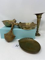 Photo of all five brass and metal items including holy water holder, bowl, ashtray, vase and change dish