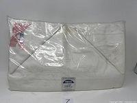 Packaged cream/off-white linen double sheet and pillowcase set with visible label and tag