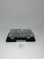 Crystal model of a 1959 Corvette car mounted on a black base with metal plaque