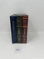 Front view of three Lord of the Rings Special Extended Edition DVD sets in slipcases: The Return of the King (blue), The Fellowship of the Ring (green), and The Two Towers (red).