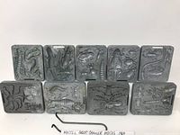 Photo showing 9 metal Creepy Crawler moulds with detailed bug designs from 1964.