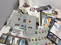 Large assortment of Kenya and Africa stamps displayed mostly on album pages and sheets. Includes commemorative themes like the Agricultural Society of Kenya and various wildlife and portraits.