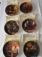 Six collector plates by Norman Rockwell shown with corresponding Certificates of Authenticity, displaying various domestic scenes.