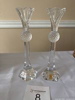 Full view of the pair of crystal candlesticks showing overall design, height, and shape.