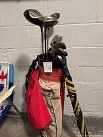 Golf bag with clubs positioned inside, showing the setup and condition of the bag and club shafts