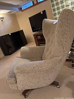 Side-angle view of entire chair in room setting.