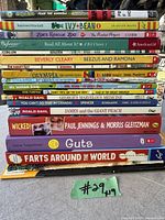 Photo showing stacked children's books with titles visible, used to identify all 19 books in the lot.