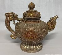 Front view of full kettle showing body, base and lid.