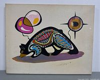 Full view of unframed canvas painting showing stylized bear and abstract motifs