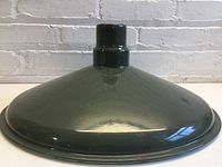 Top view of hunter green enamel metal lamp shade showing its conical shape and glossy finish.