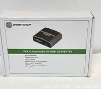 Front of the white box showing image of the converter device and specifications including VGA and audio input and HDMI output, max resolution 1920x1080 @60Hz, convert up to 1080p HDTV, HDMI transmission 5Gbps, plug and play.
