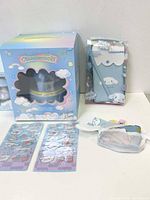 Sanrio Cinnamoroll Wishing Lamp, pencil case, stickers, and fabric pouch arranged on table