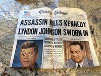 Front page of the Chicago Tribune newspaper from November 23, 1963, showing headlines about JFK assassination and Lyndon Johnson swearing in, with portraits of both presidents.