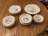 Overview of all plates and bowls arranged on a table showing the whole set.