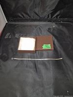 Photo of the bracelet laid out with the jewelry box, showing overall length and style.