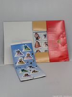 Two Canadian stamp booklets shown: one open displaying hot air balloon stamps and one closed showing NHL 50th anniversary cover with additional stamp.