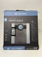 Front view of Weight Gurus Bluetooth Smart Scale box showing features and branding.
