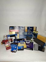 Full lot showing various sanding belts, sanding sheets, sanding blocks and sponges in assorted grits and partial packs.