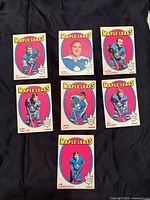 Full view of seven Toronto Maple Leafs 1971-72 hockey trading cards laid out on black fabric, showing front images and player names.