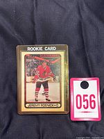 1990-91 OPC Jeremy Roenick Rookie Card #7 in protective holder with auction tag.