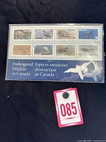 Full front view of the sealed stamp booklet showing all stamps and cover text.