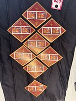 Eight diamond-shaped souvenir sheets arranged in a grid, showing the layout and quantity of the stamp sheets.