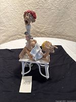 Side view showing patient laying on table and physician behind administering needle