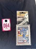 Original factory-sealed box of 1991/92 O-Pee-Chee Arktos Quebec Nordiques hockey card team set with visible packaging and identification card showing lot number 064.