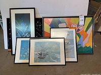 Overall view of the six framed wall art pieces in various sizes including tile art and prints.
