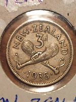 Reverse side showing crossed patu clubs, denomination, and year 1936