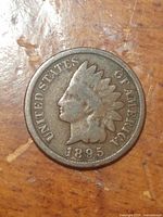 Obverse side of the 1895 Indian Head Penny, showing the Native American head with feathered headdress and inscriptions.