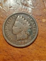 Obverse side of the 1896 Indian Head penny showing Lady Liberty's bust with a Native American headdress, LIBERTY on the headband, UNITED STATES OF AMERICA inscription, and the date 1896 at bottom.