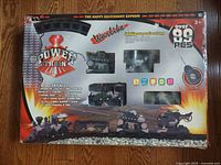 Front view of the Power Train 89 piece remote control train set box showing the products included and the branded graphics.
