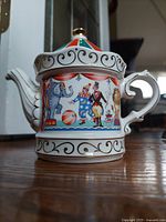 Front view of vintage Sadler Circus themed porcelain teapot with circus characters and elephant illustration