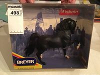 Breyer Gen. Sheridan's Winchester model horse in original box, showing black horse sculpted prancing with white markings, historical background in packaging