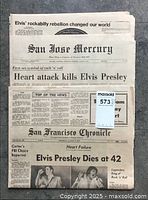 Photo of three vintage newspapers reporting Elvis Presley's death in 1977 including San Jose Mercury and San Francisco Chronicle.
