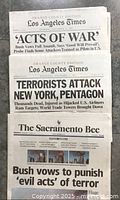 Orange County Edition Los Angeles Times front pages with headlines related to the 2001 terrorist attacks.