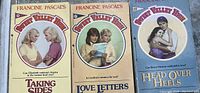 Photo of three Sweet Valley High books by Francine Pascal: 'Taking Sides,' 'Love Letters,' and 'Head Over Heels.' Covers show illustrated characters.