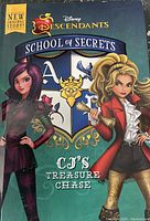 Front cover of Disney Descendants School of Secrets: CJ's Treasure Chase book showing two characters and school crest