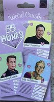 Photo of three Weird Crushes cards featuring John Travolta, Macaulay Culkin, and Jeff Goldblum with humorously rated attributes.