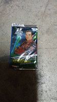 Front view of one unopened 2005 Press Pass Stealth NASCAR trading card pack featuring a driver in brown racing suit.