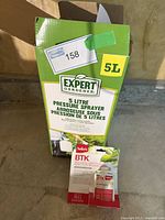 Box showing 5 litre Expert Gardener pressure sprayer label and BTK biological insecticide package in front of box.