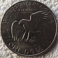 Reverse side of the 1972 Eisenhower dollar coin showing the flying eagle design with inscriptions and condition details.