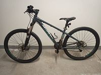 Full side profile of entire bike showing frame, wheels, fork, cockpit